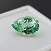 7.95ct pear-cut bluish green sapphire.